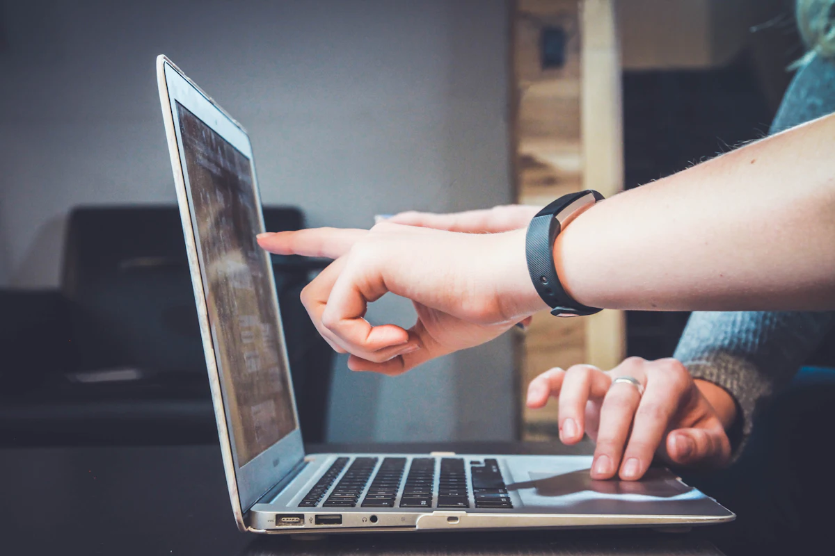 Candidate preparing a professional application on a laptop